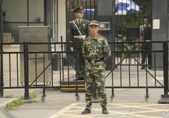 Chinese paramilitary police stand guard outside the Japanese embassy in Beijing on September 19, 2010. AFP Chinese paramilitary police stand guard outside the Japanese embassy in Beijing on September 19, 2010. AFP