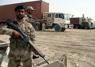 Pakistani paramilitary soldiers stand alongside trucks carrying NATO supplies at the border town of Chaman on Thursday. Pakistani paramilitary soldiers stand alongside trucks carrying NATO supplies at the border town of Chaman on Thursday.