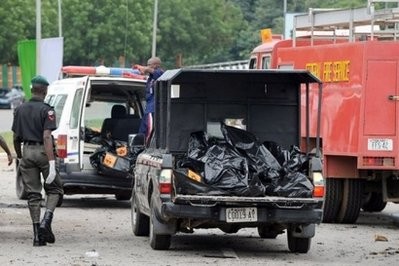 Bodybags containing the remains of victims are removed from the site of a blast in Abuja during 50th independence anniversary ceremonies. Bodybags containing the remains of victims are removed from the site of a blast in Abuja during 50th independence anniversary ceremonies.
