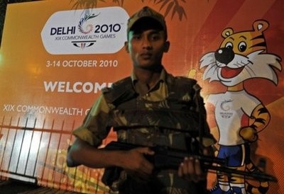 Indian policeman is seen standing guard beside a banner for the 2010 Commonwealth Games near a hotel in New Delhi, on October 1 Indian policeman is seen standing guard beside a banner for the 2010 Commonwealth Games near a hotel in New Delhi, on October 1