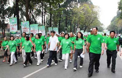 HCMC City's leaders, government employees and students take part in the walk HCMC City's leaders, government employees and students take part in the walk