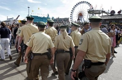 Police officers patrol through the crowd at the Oktoberfest beer festival in Munich, southern Germany, Sunday, Oct. 3, 2010 Police officers patrol through the crowd at the Oktoberfest beer festival in Munich, southern Germany, Sunday, Oct. 3, 2010