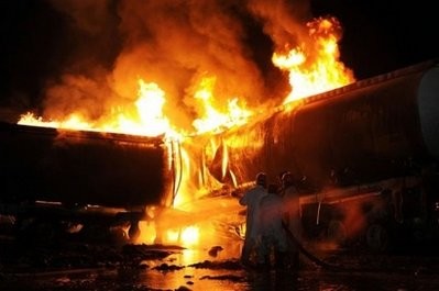 Pakistani firefighters try to extinguish burning NATO oil tankers following the gunmen attack on the outside of Islamabad Pakistani firefighters try to extinguish burning NATO oil tankers following the gunmen attack on the outside of Islamabad