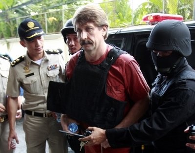 Under heavy security and wearing a bulletproof vest Viktor Bout, center, an alleged Russian arms smuggler, arrives Monday, Oct. 4, 2010, at a Bangkok criminal court for a crucial hearing that could finally determine if he will be extradited to the United States. Under heavy security and wearing a bulletproof vest Viktor Bout, center, an alleged Russian arms smuggler, arrives Monday, Oct. 4, 2010, at a Bangkok criminal court for a crucial hearing that could finally determine if he will be extradited to the United States.