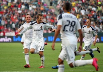 David Beckham #23 of the Los Angeles Galay celebrates his first half goal with teammate Edson Buddle #14 as Chris Birchall #11, Sean Franklin #28 and Michael Stephens #26. AFP David Beckham #23 of the Los Angeles Galay celebrates his first half goal with teammate Edson Buddle #14 as Chris Birchall #11, Sean Franklin #28 and Michael Stephens #26. AFP