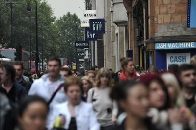 Crowds line the pavement in central London's busy retail district of the West End. Crowds line the pavement in central London's busy retail district of the West End.