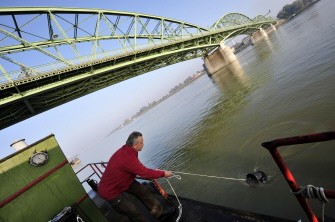 Laszlo Kiss, an official of the Hungarian enviromental service, collects a sample water for a testing from the river Danube near the Erzsebet (Elisabeth) bridge in Komarom, some 110kms from Budapest on October 8, 2010. AFP Laszlo Kiss, an official of the Hungarian enviromental service, collects a sample water for a testing from the river Danube near the Erzsebet (Elisabeth) bridge in Komarom, some 110kms from Budapest on October 8, 2010. AFP