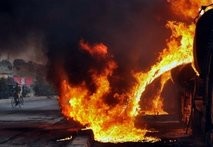 AFP/File – NATO tankers burn following an attack in Nowshera October 6. AFP/File – NATO tankers burn following an attack in Nowshera October 6.