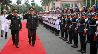 This photo taken on October 10, 2010 shows Chinese Defense Minister Liang Guanglie (C) and his Vietnamese counterpart Phung Quang Thanh (2nd L) saluting as they review an honour guard during a welcoming ceremony in Hanoi. AFP This photo taken on October 10, 2010 shows Chinese Defense Minister Liang Guanglie (C) and his Vietnamese counterpart Phung Quang Thanh (2nd L) saluting as they review an honour guard during a welcoming ceremony in Hanoi. AFP