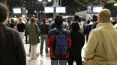 Commuters read information boards at Saint-Lazare railway station in Paris. AFP Commuters read information boards at Saint-Lazare railway station in Paris. AFP