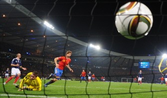 Spanish forward Fernando Llorente (C) scores the third goal past Scottish goalkeeper Allan McGregor. AFP Spanish forward Fernando Llorente (C) scores the third goal past Scottish goalkeeper Allan McGregor. AFP