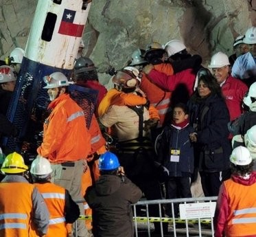 Chilean miner Florencio Avalos (C in beige suit) embraces rescuers after coming out of the Fenix capsule which brought him safely to the surface following a 10-week ordeal in the collapsed San Jose mine, near Copiapo, 800 km north of Santiago, Chile Chilean miner Florencio Avalos (C in beige suit) embraces rescuers after coming out of the Fenix capsule which brought him safely to the surface following a 10-week ordeal in the collapsed San Jose mine, near Copiapo, 800 km north of Santiago, Chile