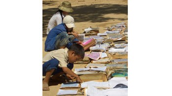 Children in Quang Binh Province were drying their books after the flood. Children in Quang Binh Province were drying their books after the flood.