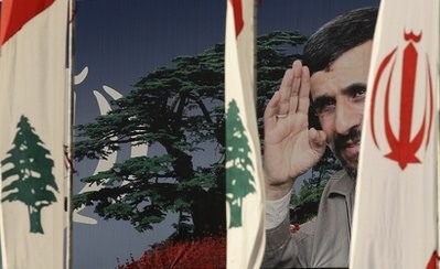 Poster of the Iranian President Mahmoud Ahmadinejad is seen between Lebanese and Iranian flags ,a day ahead of his visit, in Beirut , Lebanon, Tuesday, Oct. 12, 2010. Poster of the Iranian President Mahmoud Ahmadinejad is seen between Lebanese and Iranian flags ,a day ahead of his visit, in Beirut , Lebanon, Tuesday, Oct. 12, 2010.