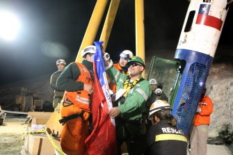 Chilean miner Jose Ojeda (C), the seventh of thirty-three miners to leave the mine exits the Fenix rescue capsule upon surfacing at the San Jose mine, near Copiapo, Chile October 13, 2010 early morning. Chilean miner Jose Ojeda (C), the seventh of thirty-three miners to leave the mine exits the Fenix rescue capsule upon surfacing at the San Jose mine, near Copiapo, Chile October 13, 2010 early morning.