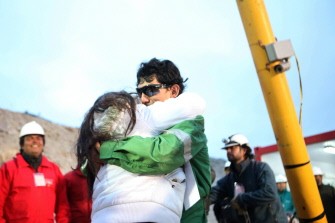 Chilean miner Claudio Yanez, the eighth of thirty-three miners to leave the mine, is hugged by a relative upon surfacing at the San Jose mine, near Copiapo, Chile October 13, 2010 early morning. Chilean miner Claudio Yanez, the eighth of thirty-three miners to leave the mine, is hugged by a relative upon surfacing at the San Jose mine, near Copiapo, Chile October 13, 2010 early morning.