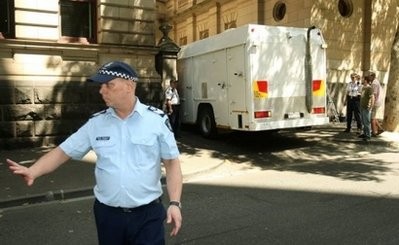 File photo shows police outside the Supreme Court in Melbourne. AFP File photo shows police outside the Supreme Court in Melbourne. AFP