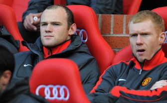 Manchester United's striker Wayne Rooney (L) starts the match on the substitutes bench for the match between Manchester United and West Bromwich Albion at Old Trafford on October 16, 2010. AFP Manchester United's striker Wayne Rooney (L) starts the match on the substitutes bench for the match between Manchester United and West Bromwich Albion at Old Trafford on October 16, 2010. AFP