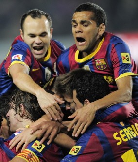 Barcelona's capitain Carles Puyol (BottomL) is congratuled by teamates after scoring during their Spanish League football match Barcelona against Valencia on October 16, 2010. AFP Barcelona's capitain Carles Puyol (BottomL) is congratuled by teamates after scoring during their Spanish League football match Barcelona against Valencia on October 16, 2010. AFP