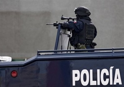 File photo shows a Mexican Federal Police agent patrolling the streets of Ciudad Juarez, Mexico File photo shows a Mexican Federal Police agent patrolling the streets of Ciudad Juarez, Mexico