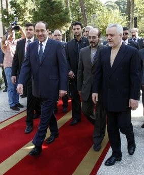 Iraqi Prime Minister Nouri al-Maliki, front left, walks along with Iranian Vice President Mohammad Reza Rahimi, right, during an official welcoming ceremony in Tehran, Iran, Monday, Oct. 18, 2010. Iraqi Prime Minister Nouri al-Maliki, front left, walks along with Iranian Vice President Mohammad Reza Rahimi, right, during an official welcoming ceremony in Tehran, Iran, Monday, Oct. 18, 2010.