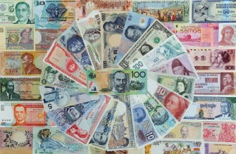 AFP - This file photo taken on May 26, 2010 shows an Australian 100 dollar note (C) amidst a raft of foreign currencies. AFP - This file photo taken on May 26, 2010 shows an Australian 100 dollar note (C) amidst a raft of foreign currencies.