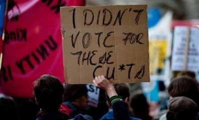 Protesters wave placards as they march on Downing Street in central London to protest against goverment spending cuts on October 20, 2010. AFP Protesters wave placards as they march on Downing Street in central London to protest against goverment spending cuts on October 20, 2010. AFP