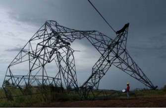 A handout photo taken on October 19, 2010 and released on October 21 by National Grid Corporation of the Philippines (NGCP) shows a worker inspecting mangled electric pylons near Gamu and Isabela towns north of Manila, destroyed by Typhoon Megi. AFP A handout photo taken on October 19, 2010 and released on October 21 by National Grid Corporation of the Philippines (NGCP) shows a worker inspecting mangled electric pylons near Gamu and Isabela towns north of Manila, destroyed by Typhoon Megi. AFP