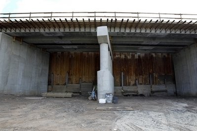In this Oct. 19, 2010 photo, a large rusty metal wall is seen in North Bergen, N.J., covering construction at the ARC Tunnel. Work on the project has been stopped by New Jersey Gov. Chris Christie In this Oct. 19, 2010 photo, a large rusty metal wall is seen in North Bergen, N.J., covering construction at the ARC Tunnel. Work on the project has been stopped by New Jersey Gov. Chris Christie