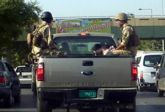 Iraqi soldiers from the Ministry of Defence sit along side blindfolded detainees in the back of a pick-up truck, as they drive along a road in the Iraqi capital Baghdad, on October 24, 2010, a day after WikiLeaks founder Julian Assange defended the unauthorised release of 400,000 classified US military documents on the war in Iraq. AFP Iraqi soldiers from the Ministry of Defence sit along side blindfolded detainees in the back of a pick-up truck, as they drive along a road in the Iraqi capital Baghdad, on October 24, 2010, a day after WikiLeaks founder Julian Assange defended the unauthorised release of 400,000 classified US military documents on the war in Iraq. AFP
