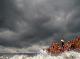A man watches as waves crash into rocks in Zhangpu on October 23, 2010 in Fujian province. AFP A man watches as waves crash into rocks in Zhangpu on October 23, 2010 in Fujian province. AFP