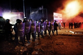 Riot police scatters demonstartors protesting against the opening of a new dump on the slopes of Mount Vesuvius in Terzigno on October 23, 2010. AFP Riot police scatters demonstartors protesting against the opening of a new dump on the slopes of Mount Vesuvius in Terzigno on October 23, 2010. AFP