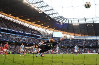 Arsenal's Alexandre song (L), scores against Manchester City's English goalkeeper Joe Hart (C) on Oct. 24, 2010. AFP Arsenal's Alexandre song (L), scores against Manchester City's English goalkeeper Joe Hart (C) on Oct. 24, 2010. AFP