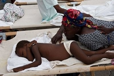 A woman checks on her cholera-stricken child at Saint Nicolas hospital in Saint-Marc, 100 kms (62 miles) north of Port-au-Prince. A woman checks on her cholera-stricken child at Saint Nicolas hospital in Saint-Marc, 100 kms (62 miles) north of Port-au-Prince.