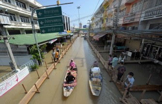 Residents paddle through floodwater in Ayutthaya province, north of the Thai capital Bangkok on October 30, 2010. AFP Residents paddle through floodwater in Ayutthaya province, north of the Thai capital Bangkok on October 30, 2010. AFP