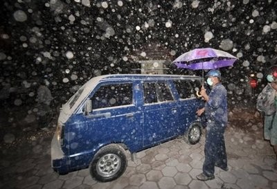 Ash rains outside a hospital during an evacuation prompted by a new violent Mount Merapi explosion, in Pakem, early on October 30. Ash rains outside a hospital during an evacuation prompted by a new violent Mount Merapi explosion, in Pakem, early on October 30.