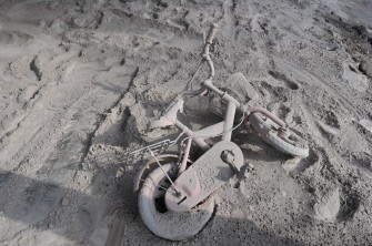 AFP - A bike lies down at an abandoned house covered with ash on the slope of Merapi mountain, in Kaliadem, Sleman on October 31, 2010. AFP - A bike lies down at an abandoned house covered with ash on the slope of Merapi mountain, in Kaliadem, Sleman on October 31, 2010.