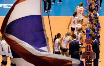 A Thai supporter waves the national flag to celebrate the victory over Croatia while Thai players (R) shake hands with Croatian players. AFP A Thai supporter waves the national flag to celebrate the victory over Croatia while Thai players (R) shake hands with Croatian players. AFP
