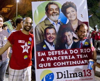 A supporter of Brazilian President elect Dilma Rousseff poses with a campaign banner celebrating her victory at Leme beach, in Rio de Janeiro, Brazil on October 31, 2010. AFP A supporter of Brazilian President elect Dilma Rousseff poses with a campaign banner celebrating her victory at Leme beach, in Rio de Janeiro, Brazil on October 31, 2010. AFP
