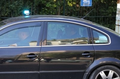 A police car carries two men, not seen inside car, who were detained after an explosion at a private delivery company in Athens, Monday, Nov. 1, 2010 A police car carries two men, not seen inside car, who were detained after an explosion at a private delivery company in Athens, Monday, Nov. 1, 2010