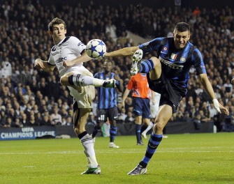 Tottenham Hotspur's Welsh defender Gareth Bale (L) vies with Inter Milan's Brazilian defender Lucio (R) on November 2, 2010. AFP Tottenham Hotspur's Welsh defender Gareth Bale (L) vies with Inter Milan's Brazilian defender Lucio (R) on November 2, 2010. AFP