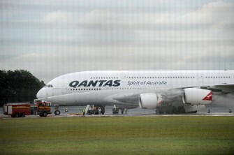 Fire services spray liquid at the engine of the Qantas Airbus A380 aircraft that was forced to make an emergency landing on the runway of Changi International airport in Singapore on November 4, 2010. Fire services spray liquid at the engine of the Qantas Airbus A380 aircraft that was forced to make an emergency landing on the runway of Changi International airport in Singapore on November 4, 2010.