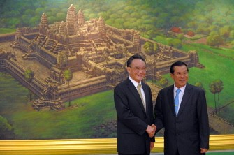 Wu Bangguo (L) shakes hand with Cambodian Prime Minister Hun Sen (R) during a meeting at the Council of Ministers in Phnom Penh on November 4, 2010. AFP Wu Bangguo (L) shakes hand with Cambodian Prime Minister Hun Sen (R) during a meeting at the Council of Ministers in Phnom Penh on November 4, 2010. AFP
