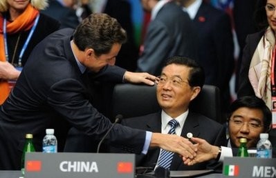 French President Nicolas Sarkozy (L) meets Chinese President Hu Jintao (C) at the start of the Opening Plenary Session at the G20 Summit in Seoul on November 12, 2010. French President Nicolas Sarkozy (L) meets Chinese President Hu Jintao (C) at the start of the Opening Plenary Session at the G20 Summit in Seoul on November 12, 2010.