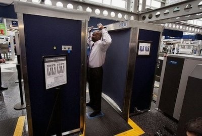 A Transportation Security Administration (TSA) volunteer demonstrates a full-body scanner at O'Hare International Airport in March. A Transportation Security Administration (TSA) volunteer demonstrates a full-body scanner at O'Hare International Airport in March.