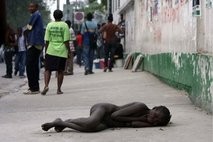 A woman suffering from cholera lies on the pavement near the General Hospital (AFP) A woman suffering from cholera lies on the pavement near the General Hospital (AFP)