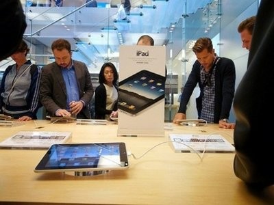AFP file - People are seen here shopping at a Apple store in New York. AFP file - People are seen here shopping at a Apple store in New York.
