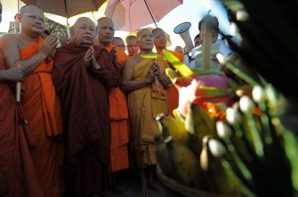 Cambodian Buddhist monks gather to pray for victims of the stampede in front of the bridge in Phnom Penh on November 23, 2010. AFP Cambodian Buddhist monks gather to pray for victims of the stampede in front of the bridge in Phnom Penh on November 23, 2010. AFP