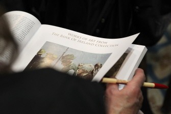 A women looks at works of art for sale from the Bank of Ireland auction in the Shelbourne Hotel in Dublin, on November 24, 2010. AFP A women looks at works of art for sale from the Bank of Ireland auction in the Shelbourne Hotel in Dublin, on November 24, 2010. AFP