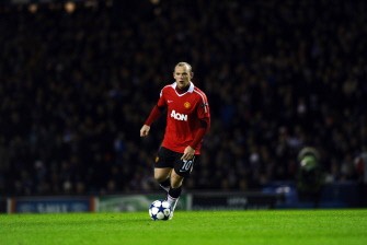Wayne Rooney runs with the ball against Rangers at Ibrox in Glasgow, Scotland, on November 24, 2010. AFP Wayne Rooney runs with the ball against Rangers at Ibrox in Glasgow, Scotland, on November 24, 2010. AFP